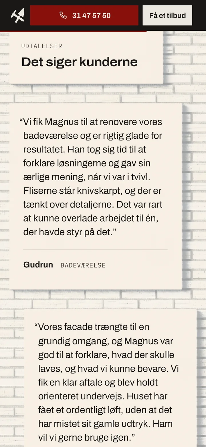 A customer's words about their new bathroom, on a patch of render on the white wall.