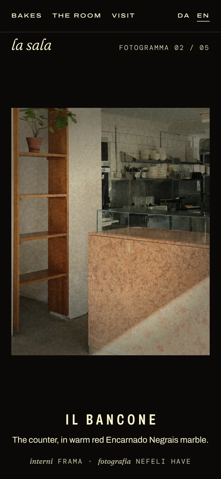 La sala on black: FRAMA's photograph of the marble counter in a film frame, IL BANCONE under it as a subtitle.