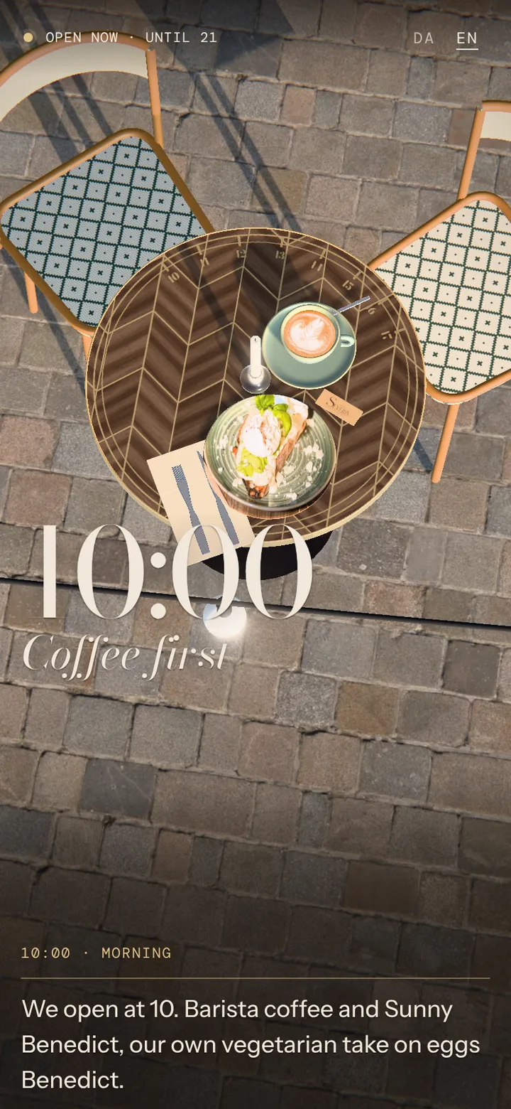 Severin's site at 10:39: the round walnut table on the cobbles in morning sun, a cappuccino and Sunny Benedict just set down.