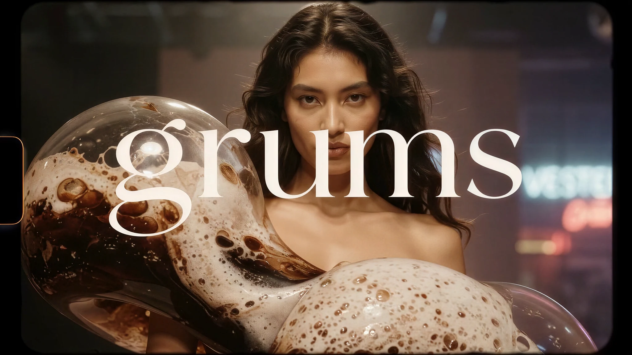 Grums couture campaign image with a translucent foam garment and complete wordmark